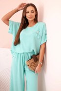 Komplet damski z wiskozy z ozdobnym kwiatem i szerokimi spodniami miętowy