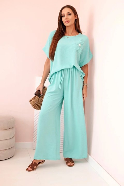 Komplet damski z wiskozy z ozdobnym kwiatem i szerokimi spodniami miętowy