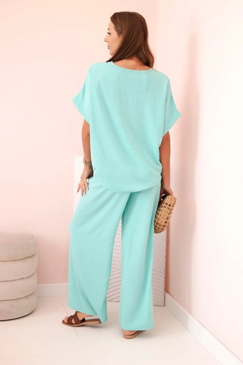 Komplet damski z wiskozy z ozdobnym kwiatem i szerokimi spodniami miętowy