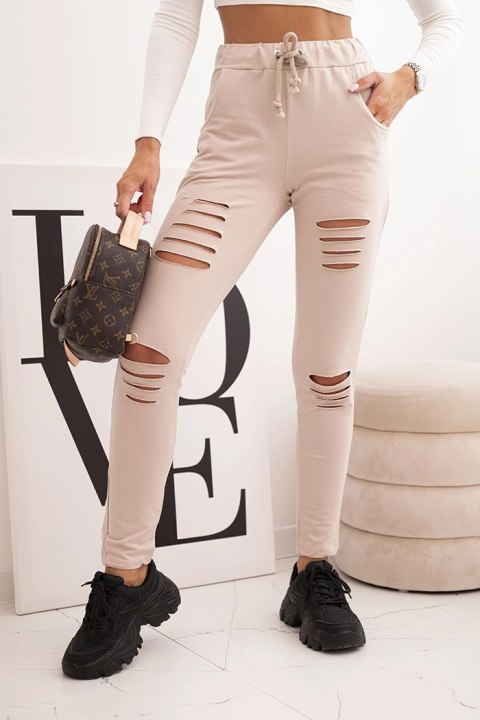 Spodnie damskie bawełniane z przetarciami i gumką w pasie beżowe