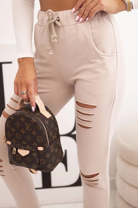 Spodnie damskie bawełniane z przetarciami i gumką w pasie beżowe