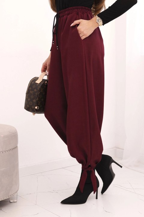 Spodnie damskie z szeroką nogawką i wiązaniem u dołu bordowe