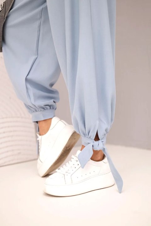 Spodnie damskie z szeroką nogawką i wiązaniem u dołu jeansowe